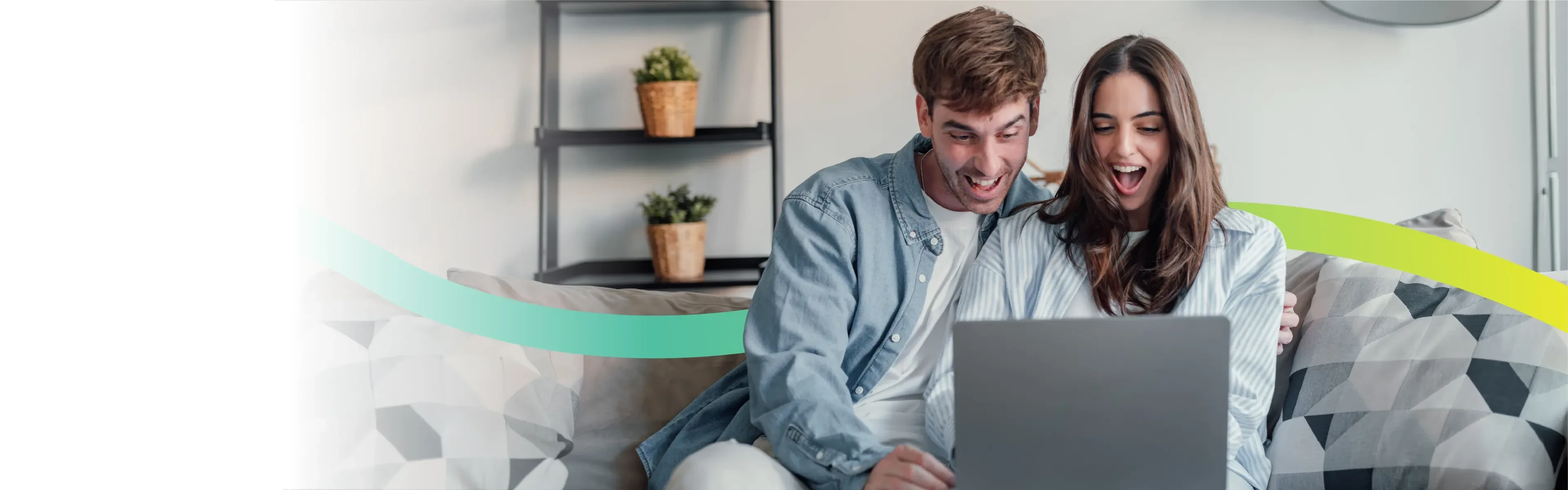Couple using a laptop at rural home with Voneus broadband