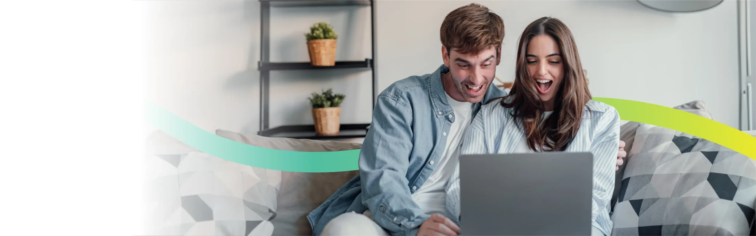 Couple using a laptop at rural home with best Voneus broadband