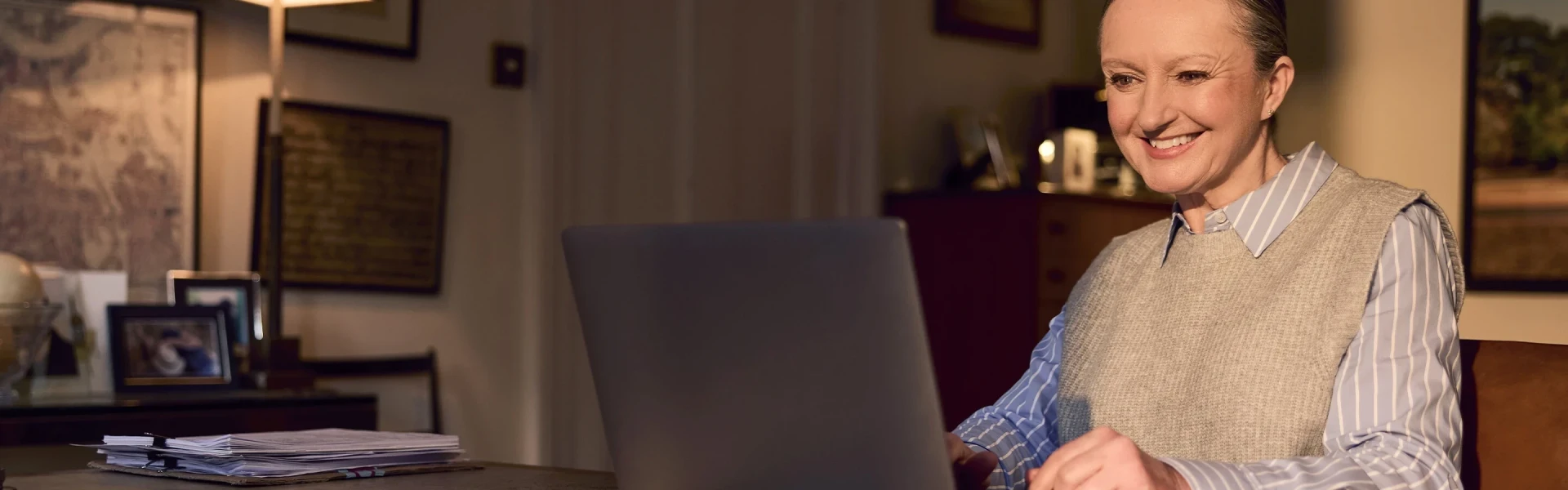 Woman using Voneus broadband at home with the Gigabit Broadband Voucher Scheme