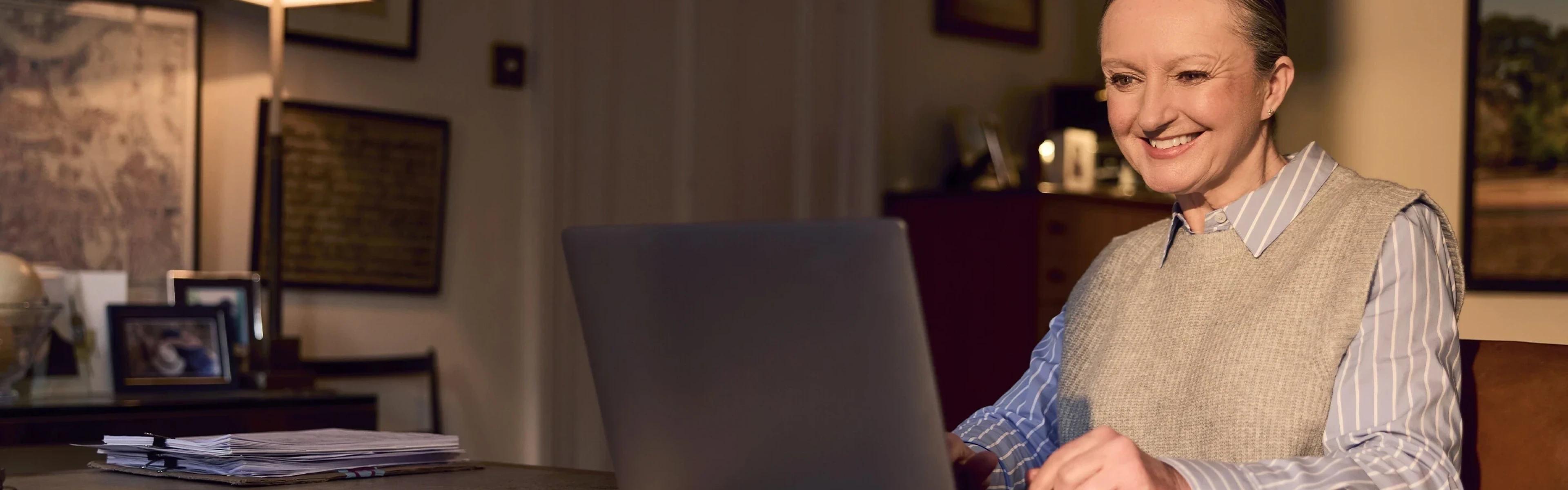 Woman using Voneus broadband at home with the Gigabit Broadband Voucher Scheme