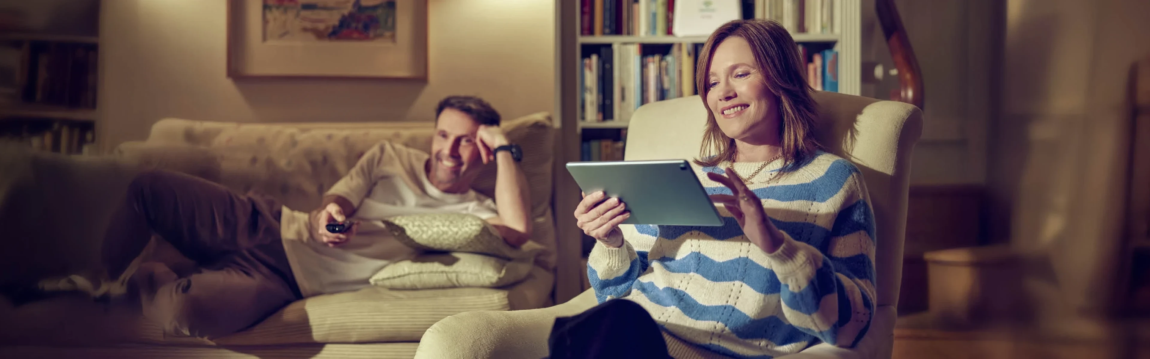 Couple using broadband at home after switching to Voneus