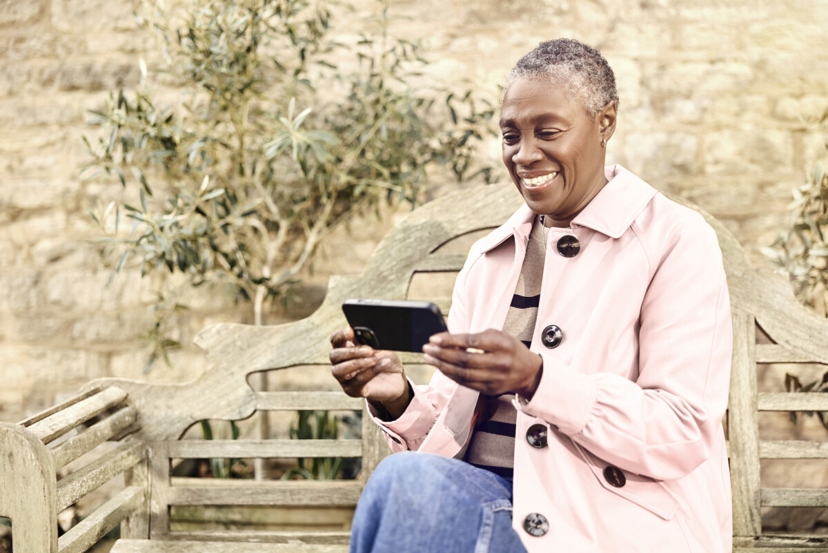 Lady using wifi broadband in the garden
