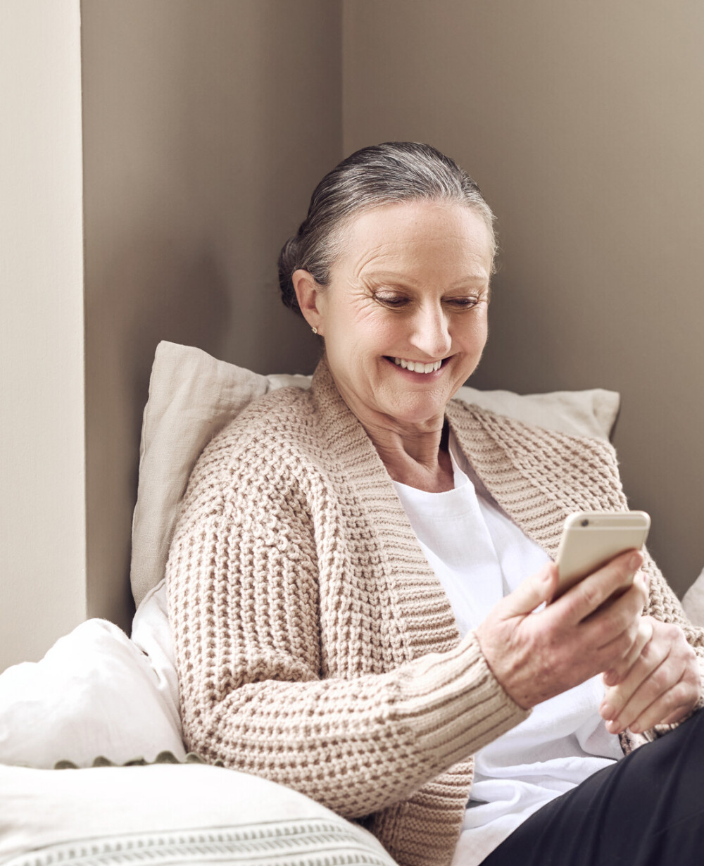 Lady video calling friend on wifi with phone