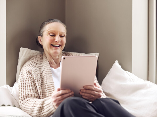Lady video calling on a tablet with ultra-fast internet