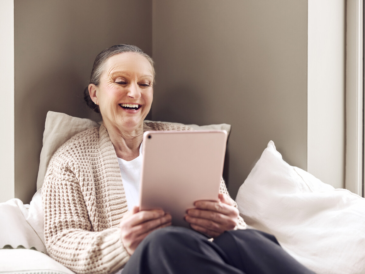 Lady video calling on a tablet with ultra-fast internet