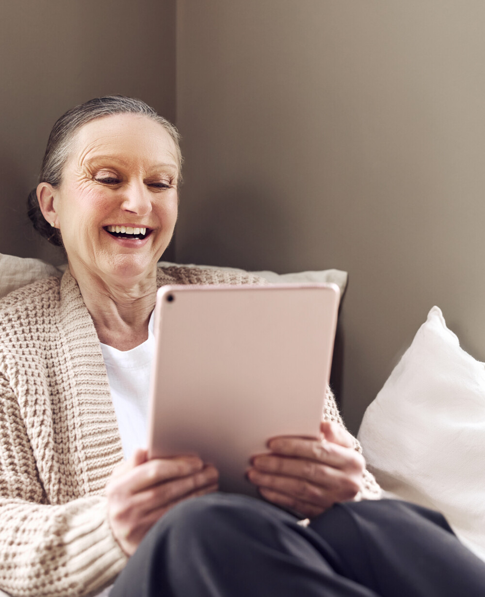 Lady video calling on a tablet with ultra-fast internet