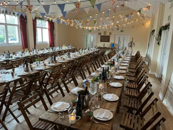 Inside Llanarth Village Hall near Raglan, with tables arranged for a community event, a local venue supported by a free Voneus Broadband connection.