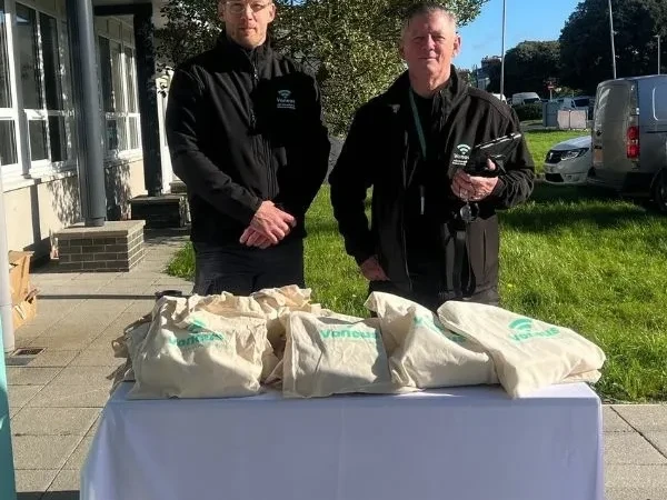 Two Voneus broadband representatives at an outdoor community information stand, promoting local broadband services for residents in Fence, Higham, Read and Sabden.