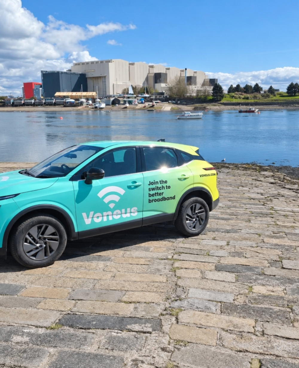 Voneus branded broadband vehicle parked beside a harbour, representing Voneus broadband services in Dale, Marloes and St Ishmaels