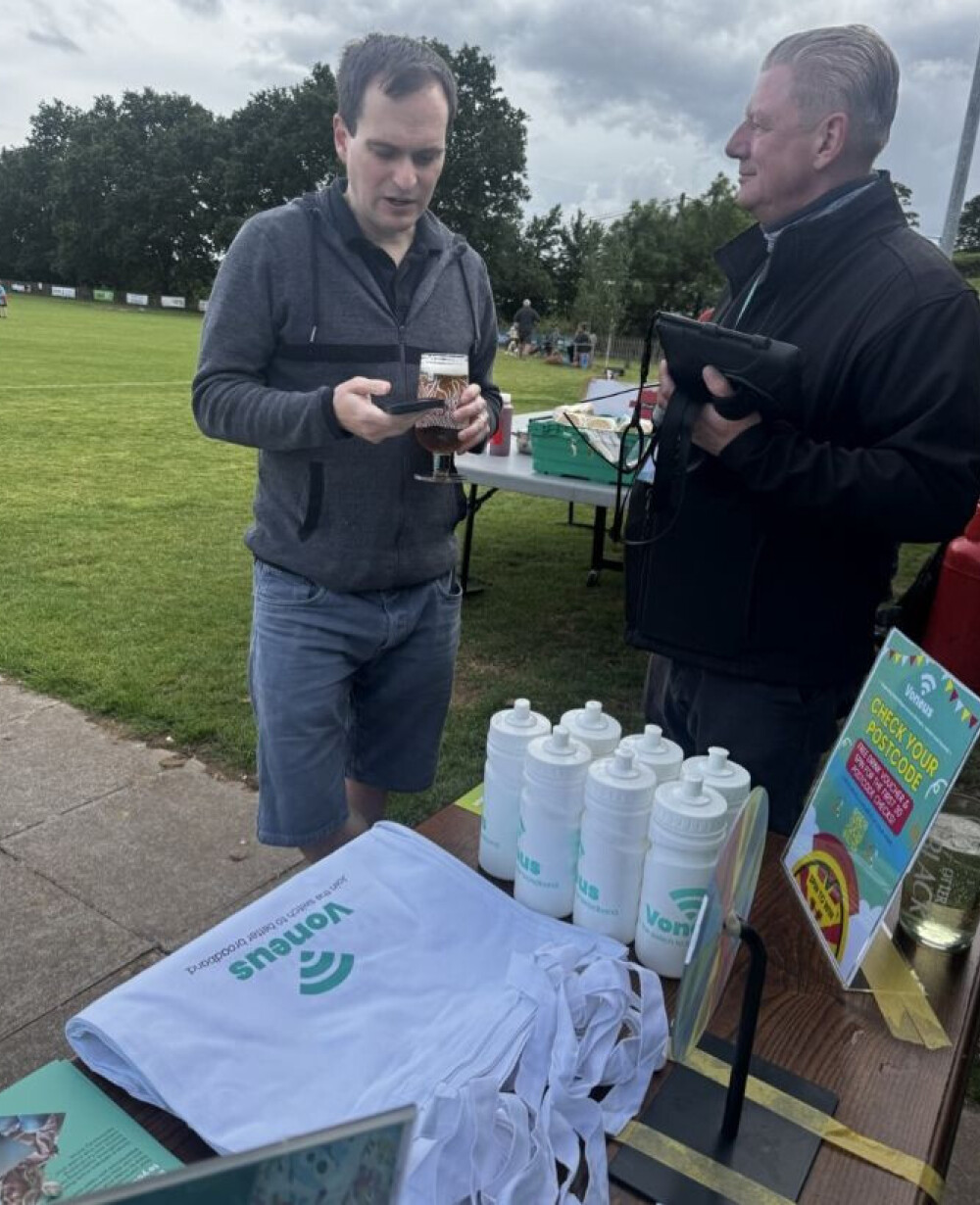 Paul speaking with a resident at Whimple Cricket Club