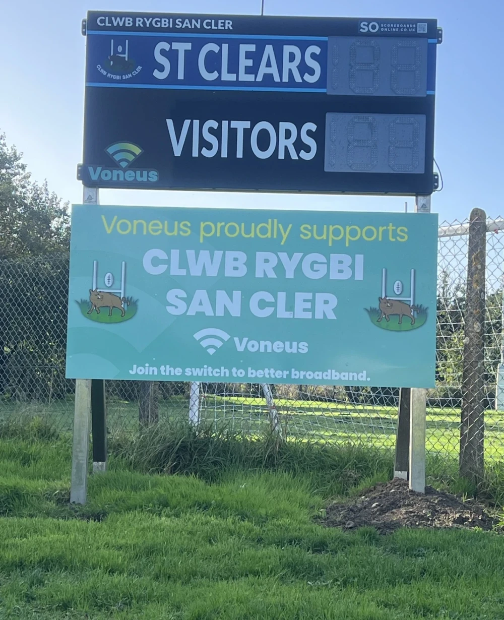 Voneus broadband sponsorship sign at St Clears Rugby Club in Carmarthenshire, supporting the local rugby club and community.