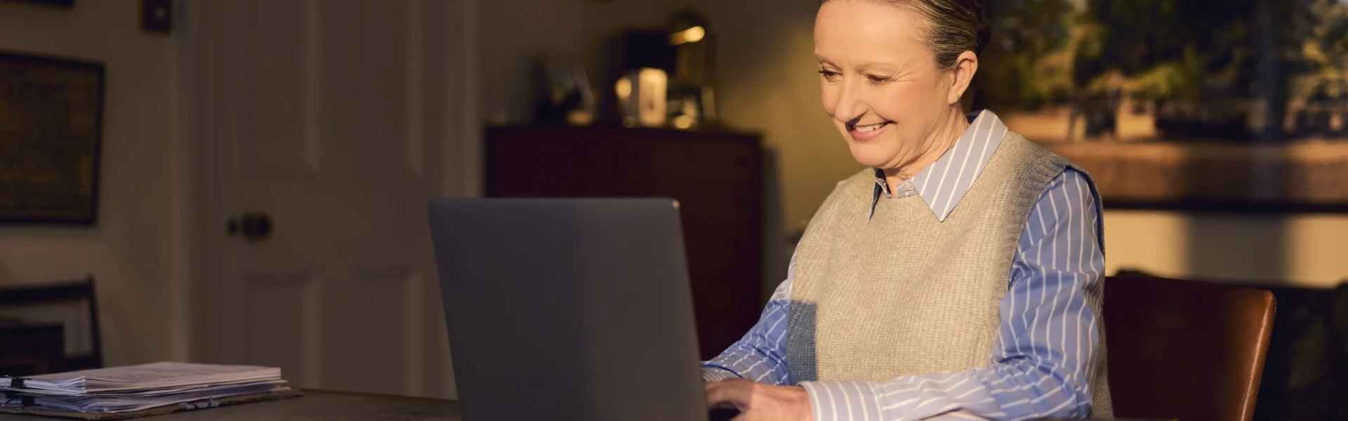 Woman using Voneus holiday park broadband on a laptop