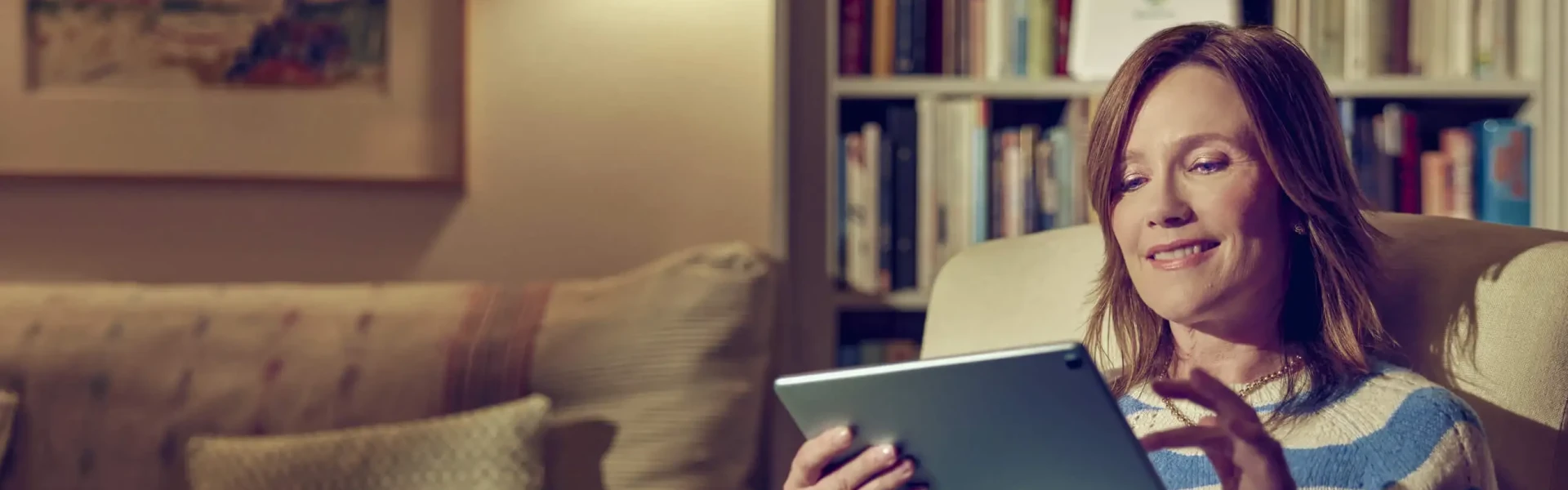 Woman using Voneus rural broadband at home in Shropshire