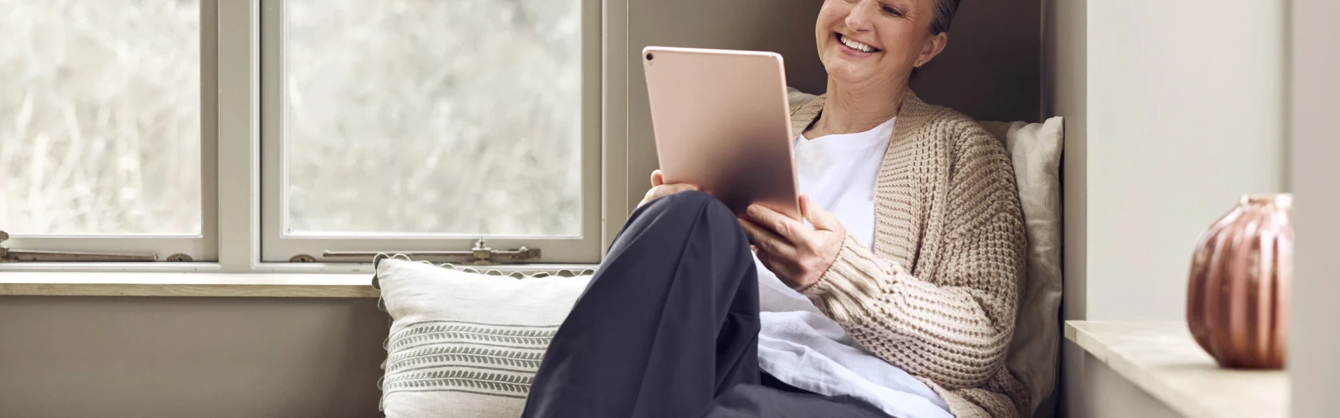 Woman using Voneus wireless broadband at home in a rural area